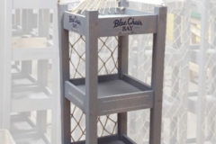Blue Chair Bay Nautical RackWood shelf display rack with sails on top and netting on back